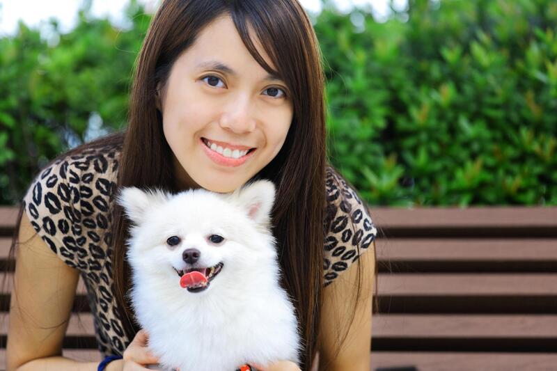 Young girl and her fluffy white dog. A very satisfied customer.